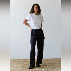 DONNI. Silk drawstring pants in olive